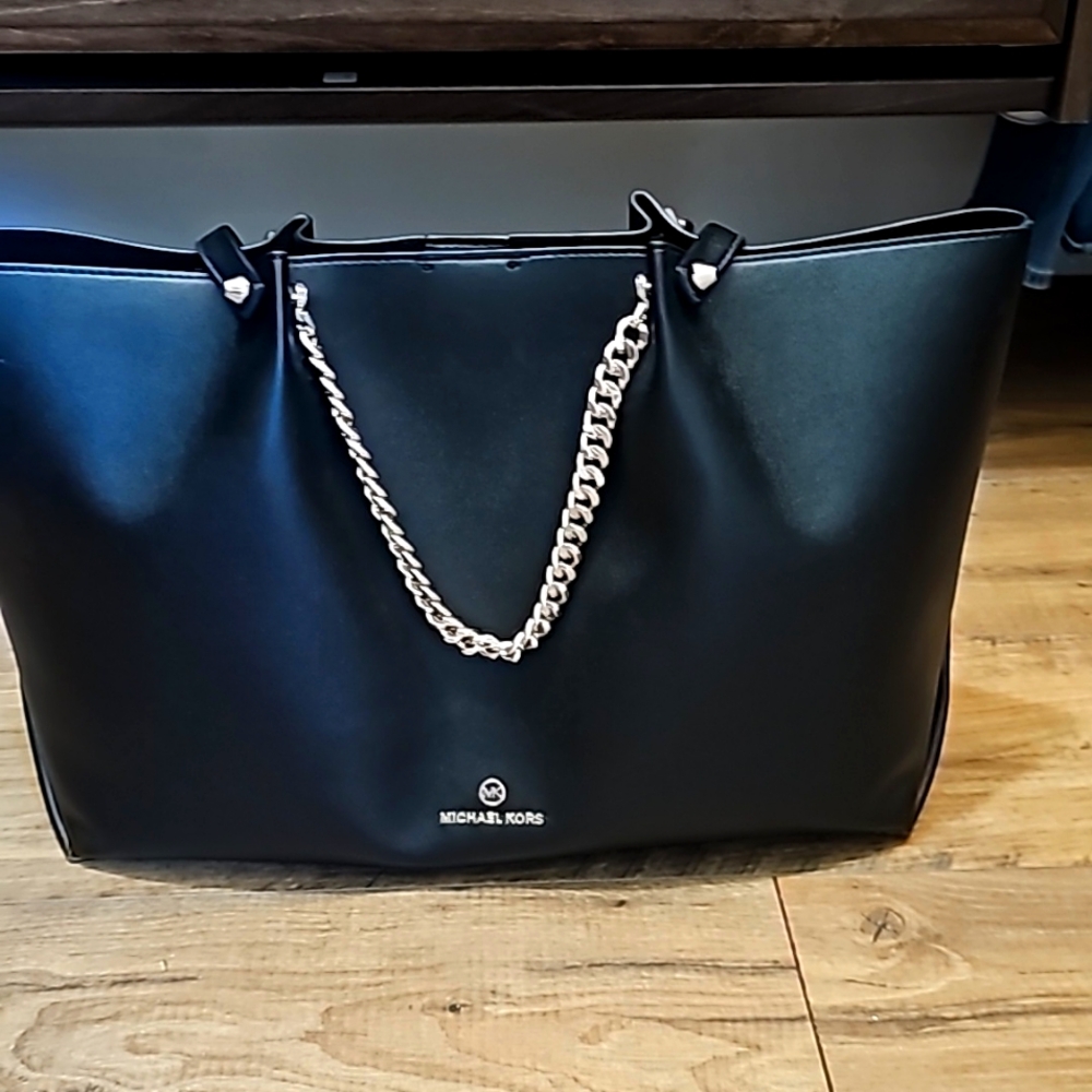 Brand new Michael Korrs purse used in runway show only. Receipt in purse. $400